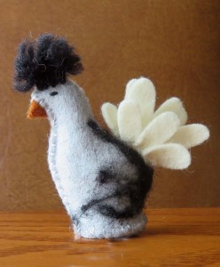 A Polish chicken at HollysMeadow, made of wool felt and stitched by hand, stands just over 2 inches high.