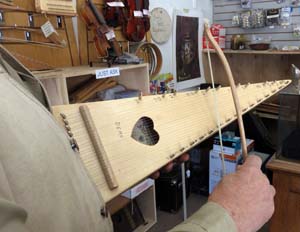 Mike Medeiros plays the bowed psaltery he made.
