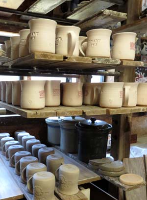 Mugs await finishing at Elk Falls Pottery