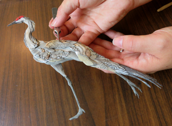 Sandhill crane paper collage and sculpture by Tiffany Russell Miller